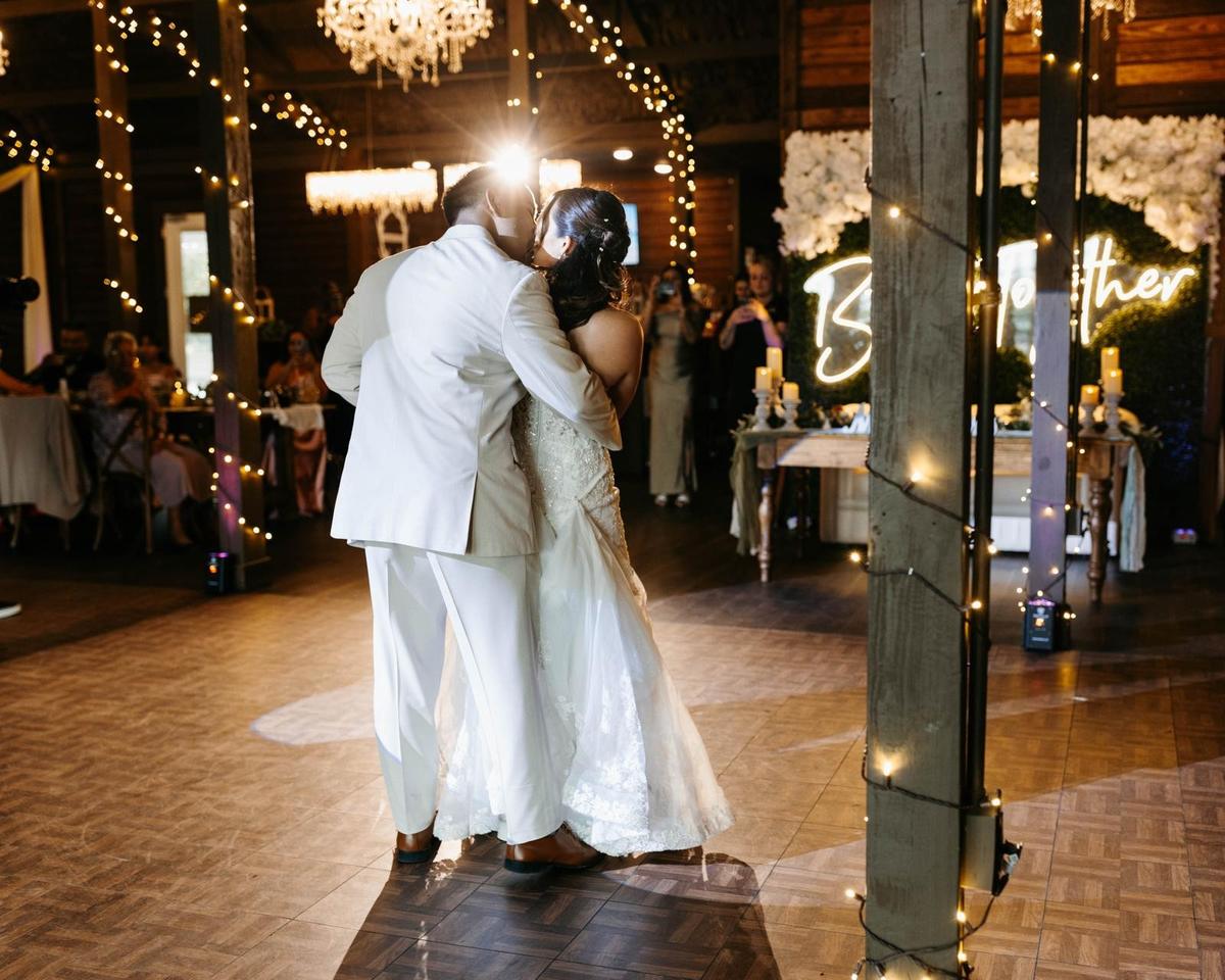 Wedding couple dancing with guests